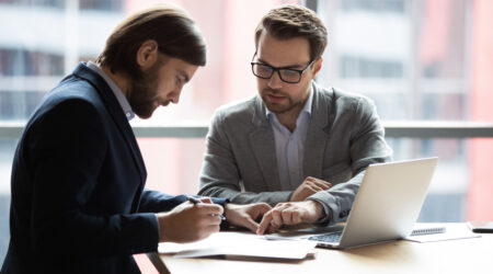 Focused,Young,Businessman,Signing,Agreement,With,Skilled,Lawyer,In,Eyeglasses.